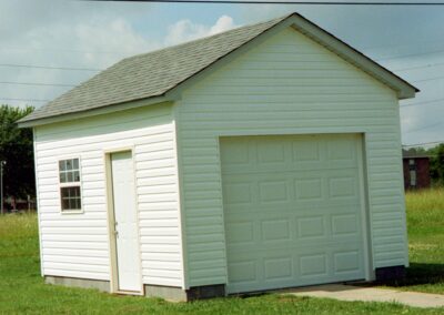 Single garage door with one walkthrough door by MasterCraft Construction