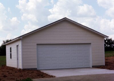 Single garage door with one walkthrough door by MasterCraft Construction