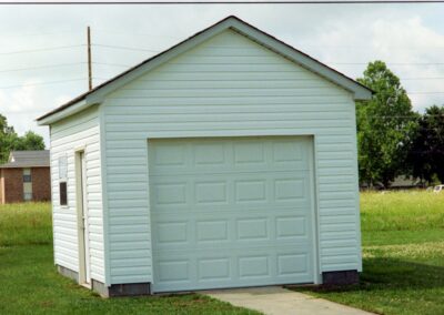 Single garage door with one walkthrough door by MasterCraft Construction