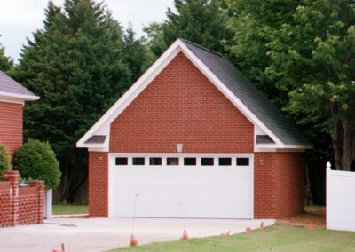Single garage door with one walkthrough door by MasterCraft Construction