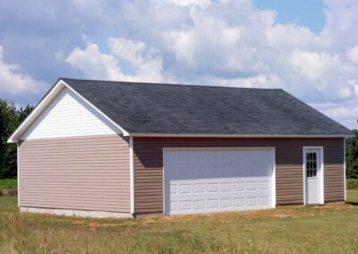 Single garage door with one walkthrough door by MasterCraft Construction