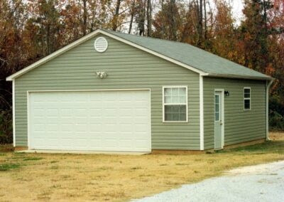 Single garage door with one walkthrough door by MasterCraft Construction