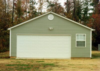 Single garage door with one walkthrough door by MasterCraft Construction