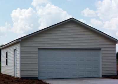 Single garage door with one walkthrough door by MasterCraft Construction