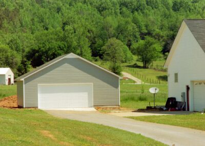 Single garage door with one walkthrough door by MasterCraft Construction