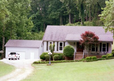 Single garage door with one walkthrough door by MasterCraft Construction