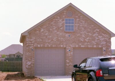 Garage with upper bonus room built by MasterCraft Construction