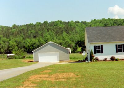 Single garage door with one walkthrough door by MasterCraft Construction