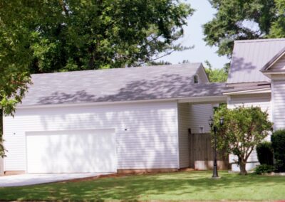 Single garage door with one walkthrough door by MasterCraft Construction