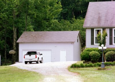 Single garage door with one walkthrough door by MasterCraft Construction