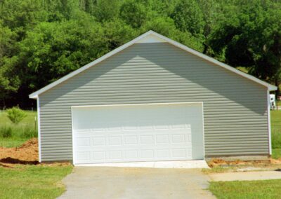 Single garage door with one walkthrough door by MasterCraft Construction