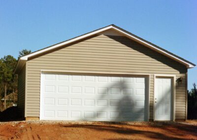Single garage door with one walkthrough door by MasterCraft Construction