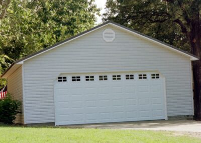 Single garage door with one walkthrough door by MasterCraft Construction