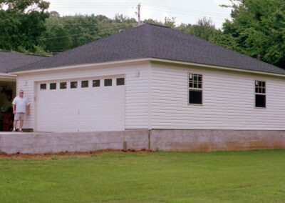 Single garage door with one walkthrough door by MasterCraft Construction