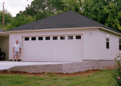 Single garage door with one walkthrough door by MasterCraft Construction