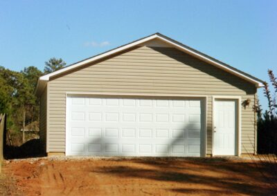 Single garage door with one walkthrough door by MasterCraft Construction
