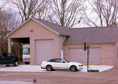Custom garage with distinctive design features by MasterCraft Construction