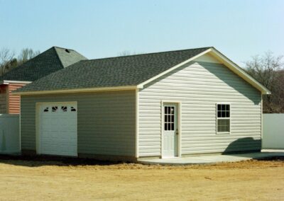 Single garage door with one walkthrough door by MasterCraft Construction