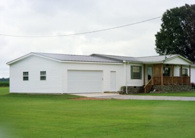 Single garage door with one walkthrough door by MasterCraft Construction