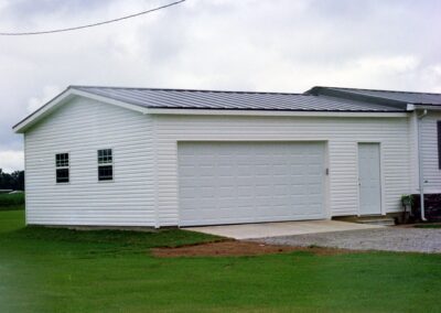 Single garage door with one walkthrough door by MasterCraft Construction