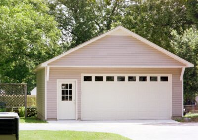 Single garage door with one walkthrough door by MasterCraft Construction