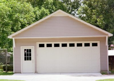 Single garage door with one walkthrough door by MasterCraft Construction