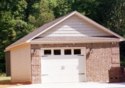 Single garage door with one walkthrough door by MasterCraft Construction