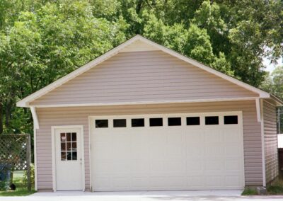 Single garage door with one walkthrough door by MasterCraft Construction