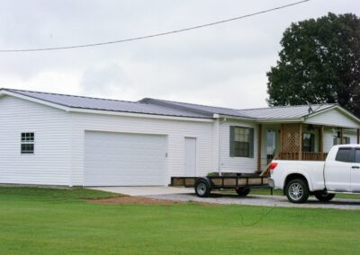 Single garage door with one walkthrough door by MasterCraft Construction
