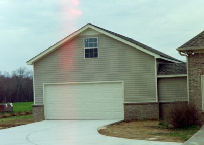 Garage with upper bonus room built by MasterCraft Construction