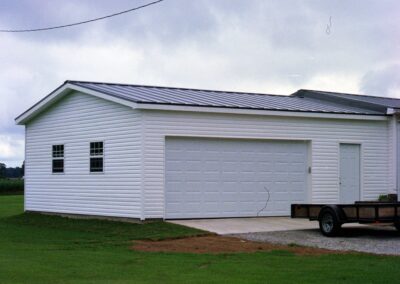 Single garage door with one walkthrough door by MasterCraft Construction