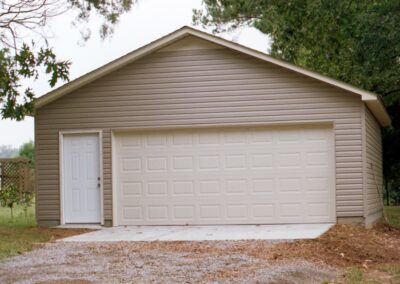 Single garage door with one walkthrough door by MasterCraft Construction