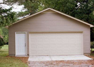 Single garage door with one walkthrough door by MasterCraft Construction