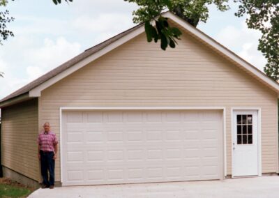 Single garage door with one walkthrough door by MasterCraft Construction