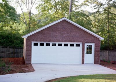 Single garage door with one walkthrough door by MasterCraft Construction